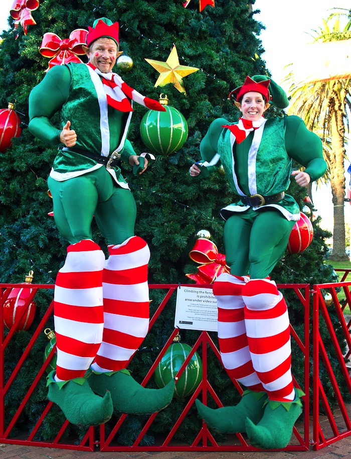 CHRISTMAS ELF STILTS - BOUNCING COMICAL STILTS - FUN XMAS ACTS TO HIRE UK